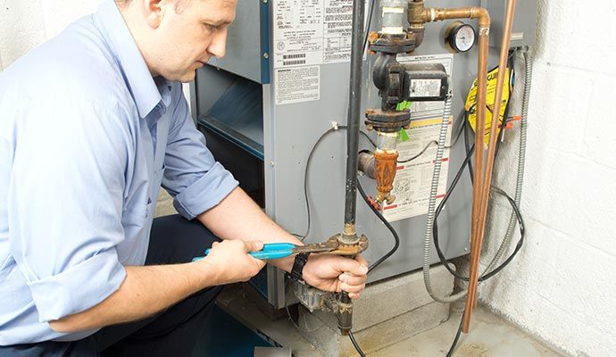 Person replacing damaged AC