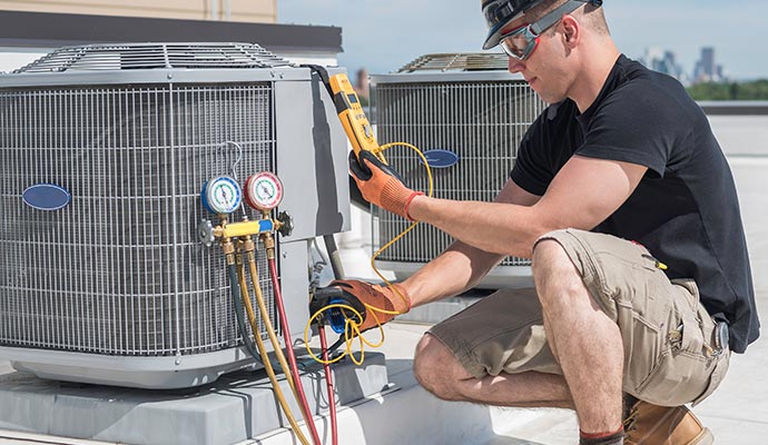 Professional inspecting AC