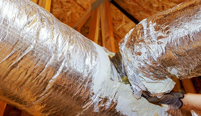 Professional duct sealing in progress