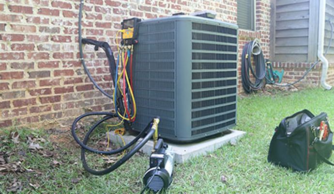 Performing heating system maintenance on outdoor unit
