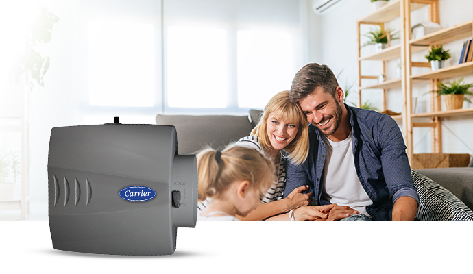 Family enjoying a bright living room with proper humidity maintained by a Carrier humidifier