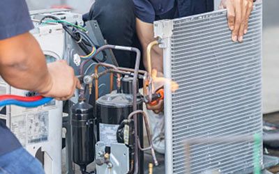 Technicians are repairing HVAC system using equipments