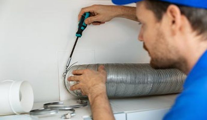 Professional worker installing ventilation tube